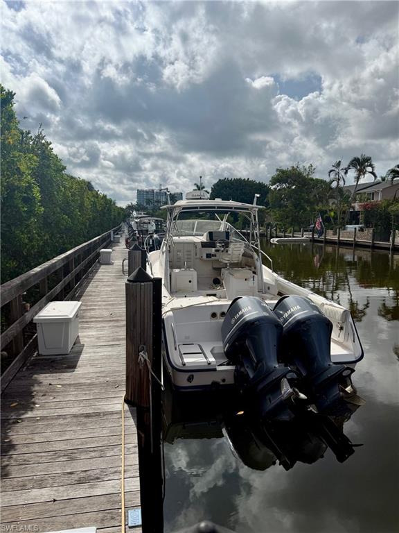 Dock area featuring boat slip C-10