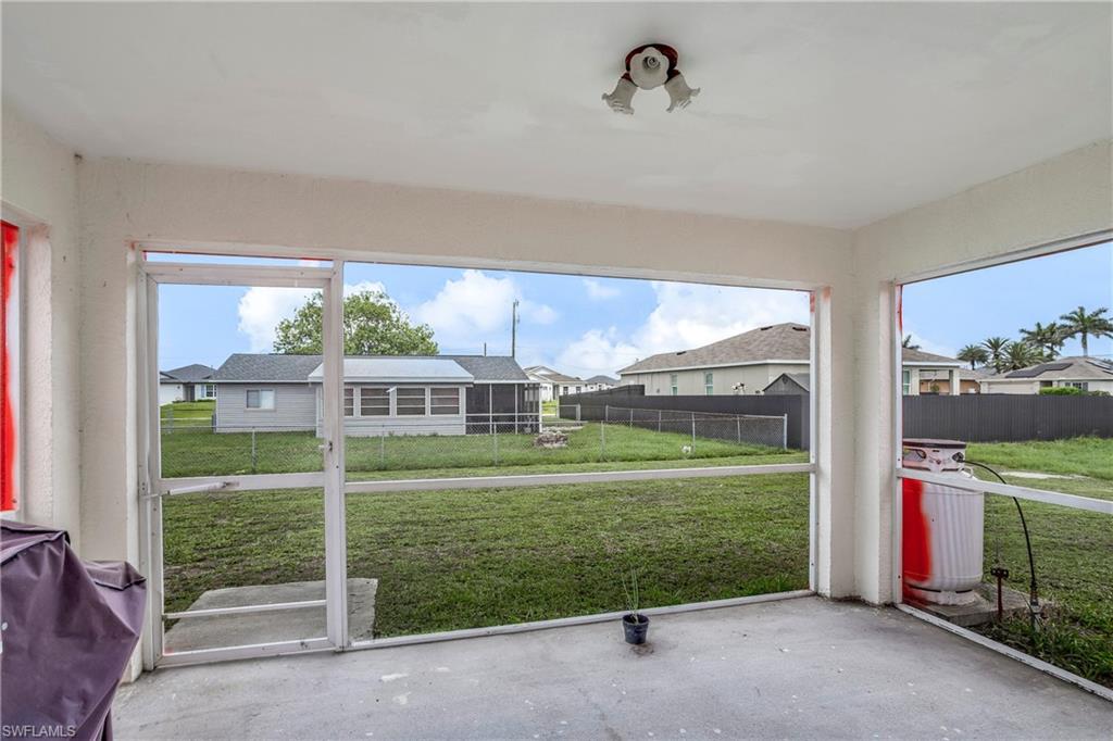 Unfurnished sunroom featuring a residential view