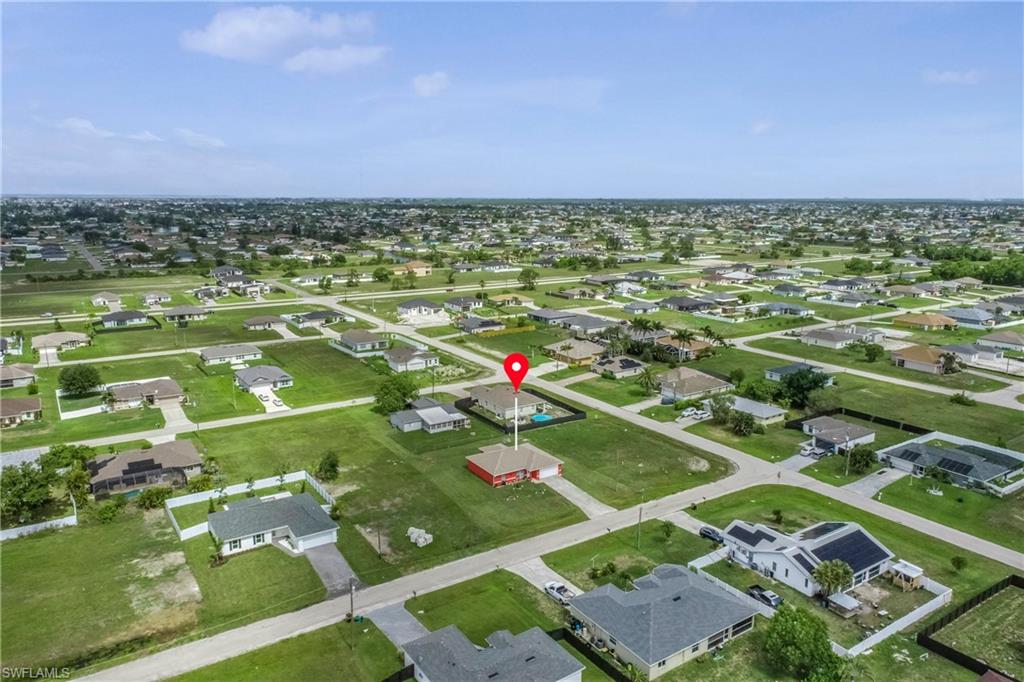 View of property location with nearby suburban area