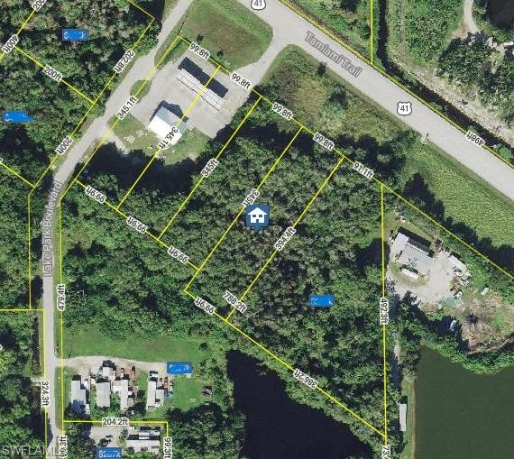 Aerial overview of property's location featuring property parcel outlined
