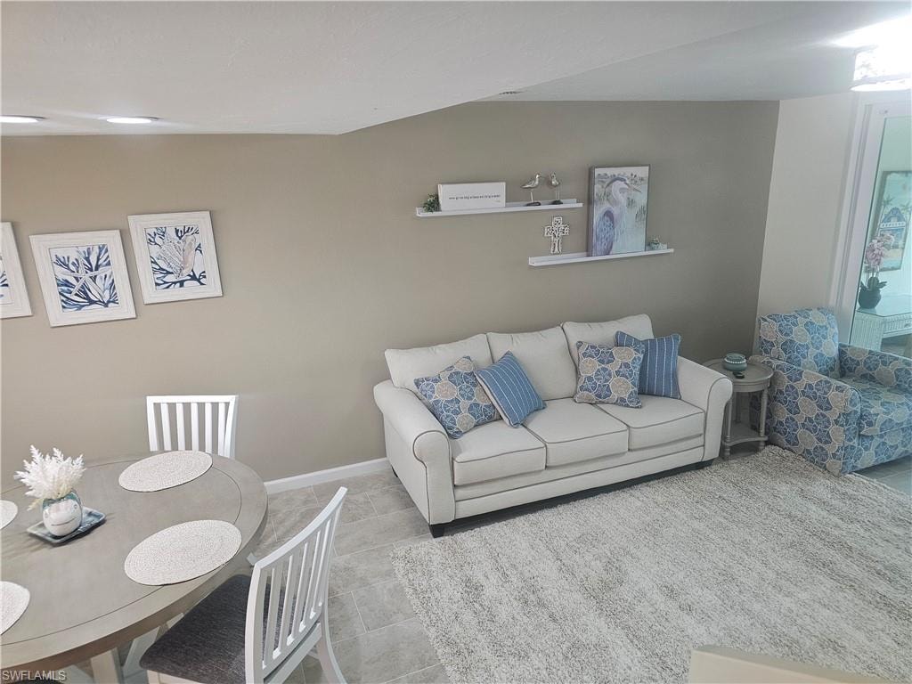 Living room featuring baseboards