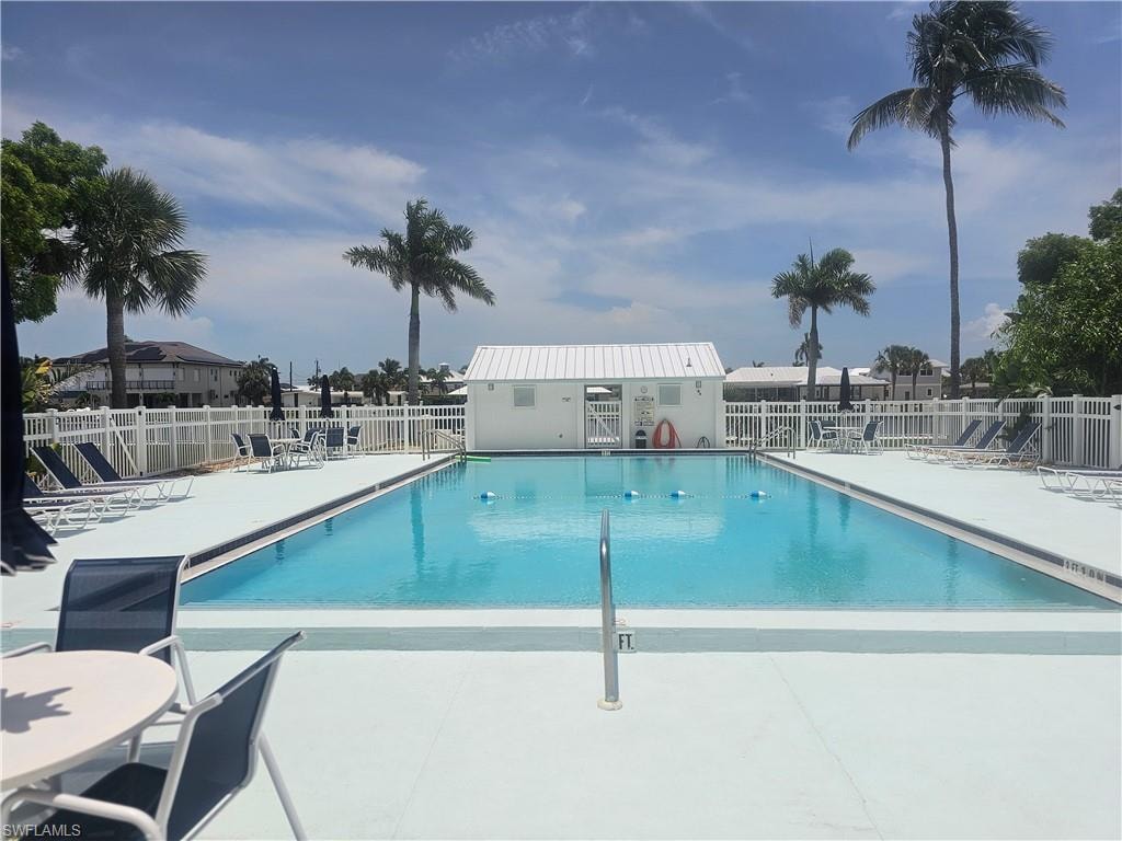 Community pool featuring a patio