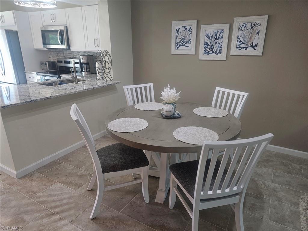 Dining space featuring baseboards