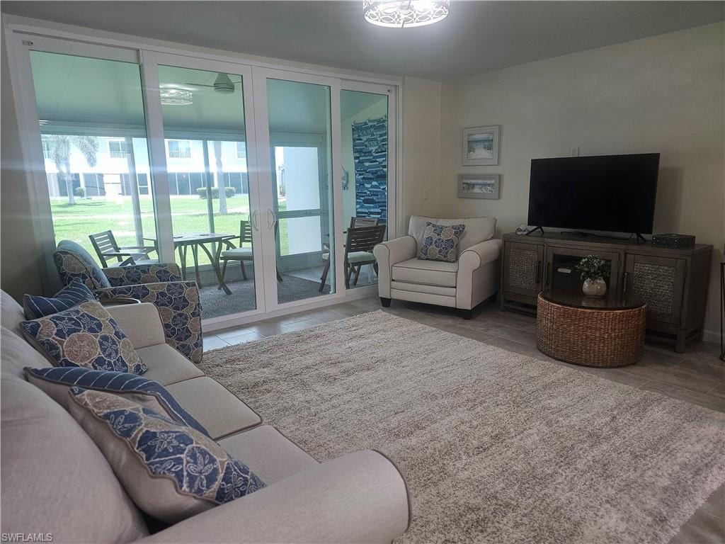 Living area featuring tile patterned flooring