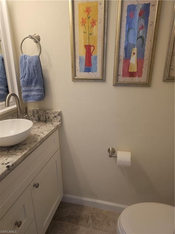 Bathroom with vanity and tile patterned floors