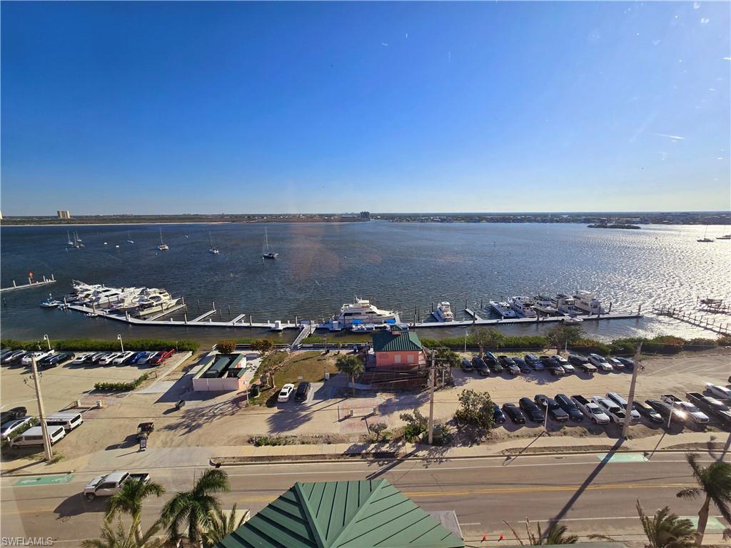 Drone / aerial view of a nearby body of water and numerous boat docks