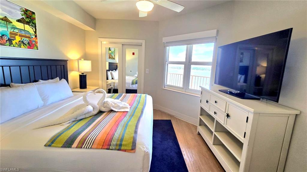 Bedroom featuring wood finished floors and ceiling fan