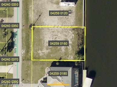 Aerial overview of property's location featuring property parcel outlined