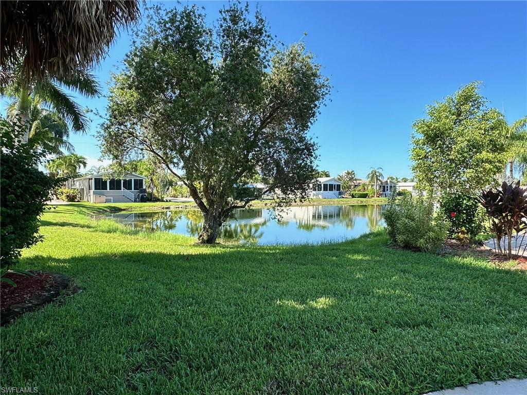 View of grassy yard featuring a water view