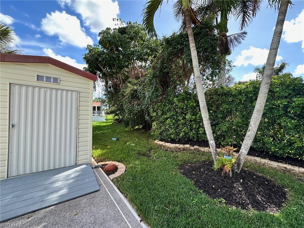 View of green lawn with a shed