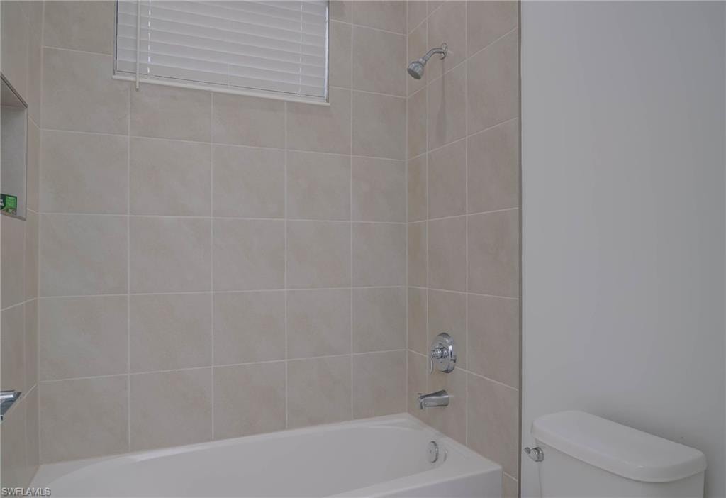 Bathroom with toilet and shower / tub combination