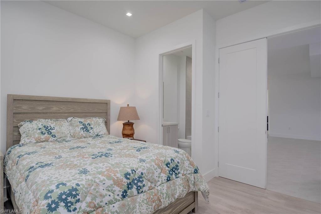 Bedroom featuring wood finished floors and recessed lighting