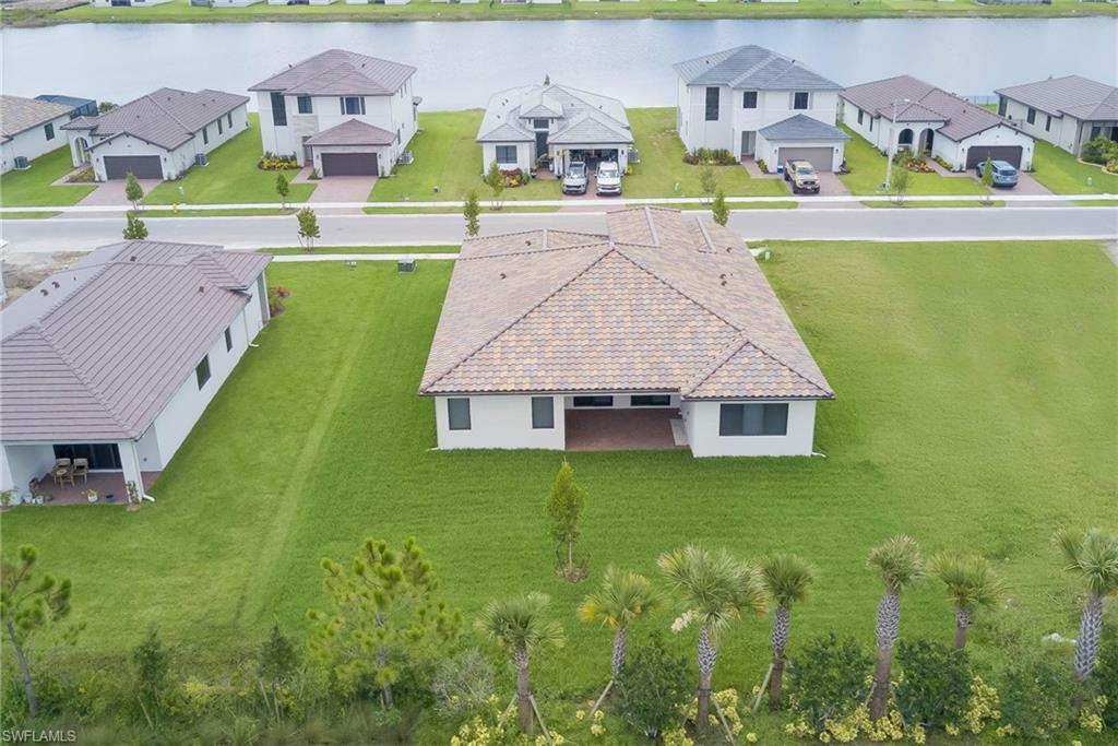 Aerial perspective of suburban area with a large body of water