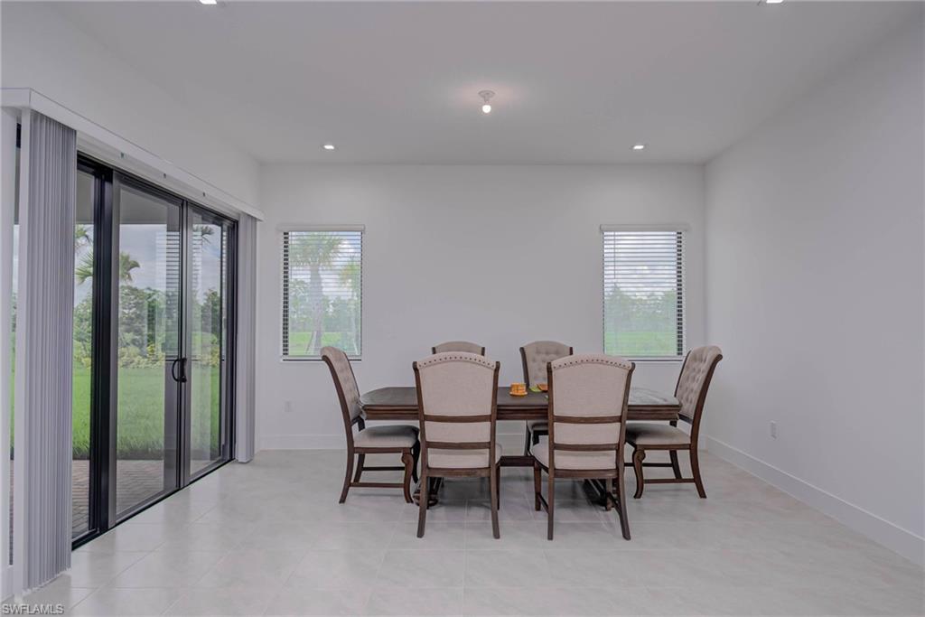 Dining space with plenty of natural light and recessed lighting