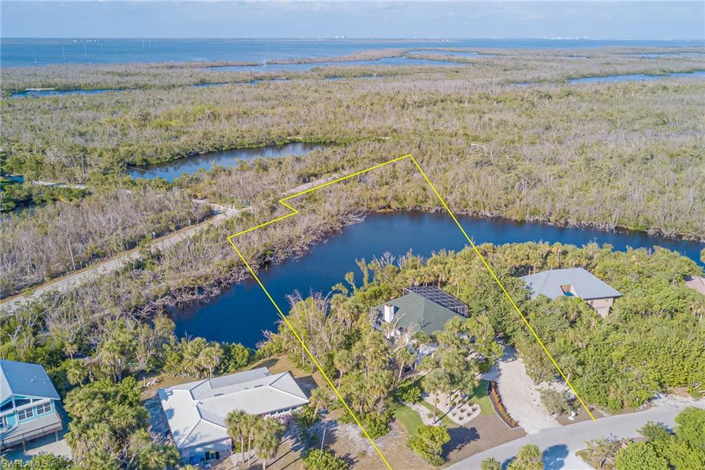 Aerial overview of property's location with property boundaries highlighted - 1.12 acres