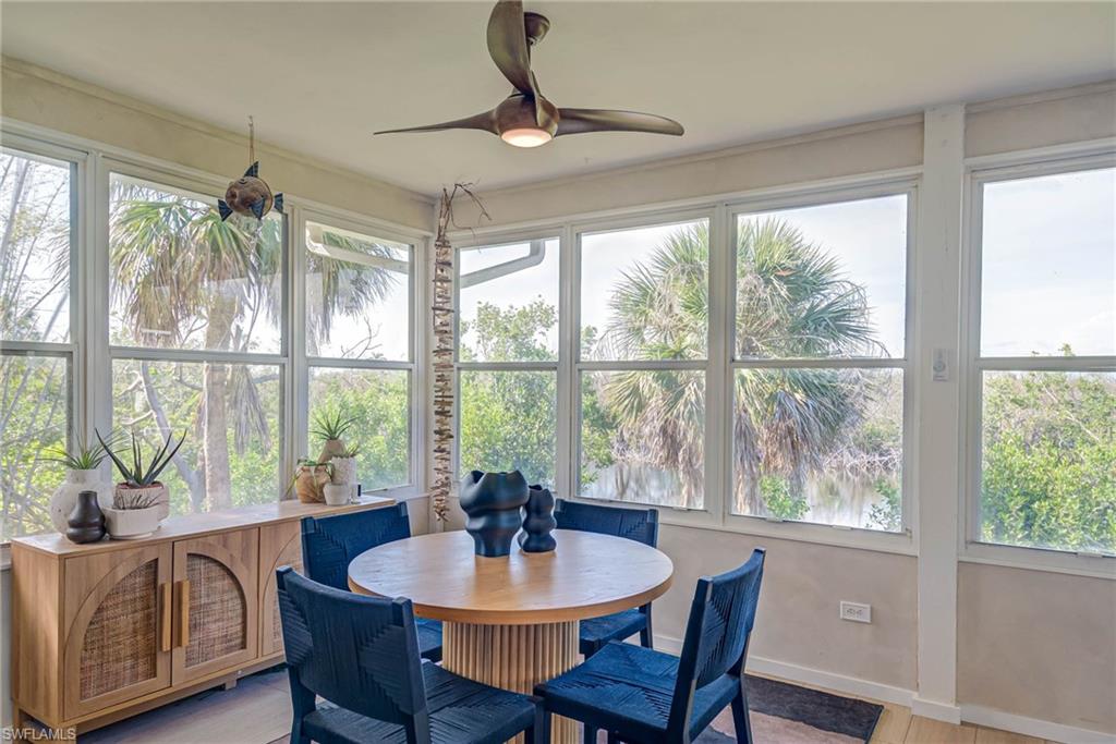 Sunroom featuring views and natural light just off living room/kitchen