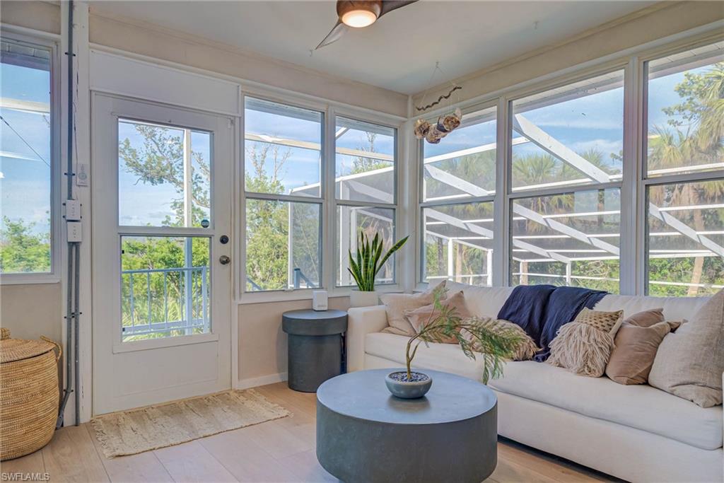 Sunroom with door to stairs down to the pool - this is just outside of primary bedroom