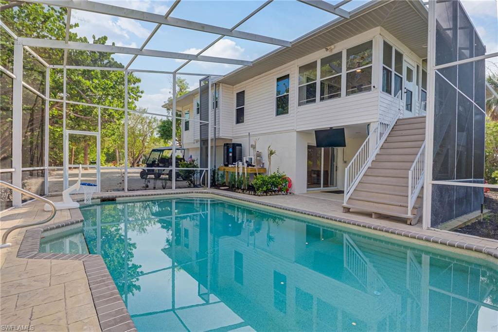Fully upgraded pool area with new saltwater pool system, heater, pump, and raised pool equipment