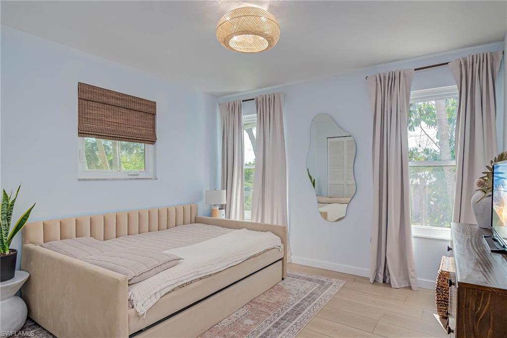 Bedroom with NEW windows, floors, curtains, and all furniture