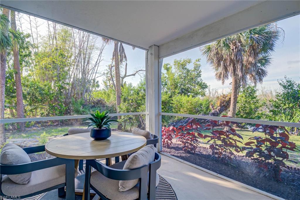 Lower level room opens to this area which is screened-in and has views of the water and leads to the pool