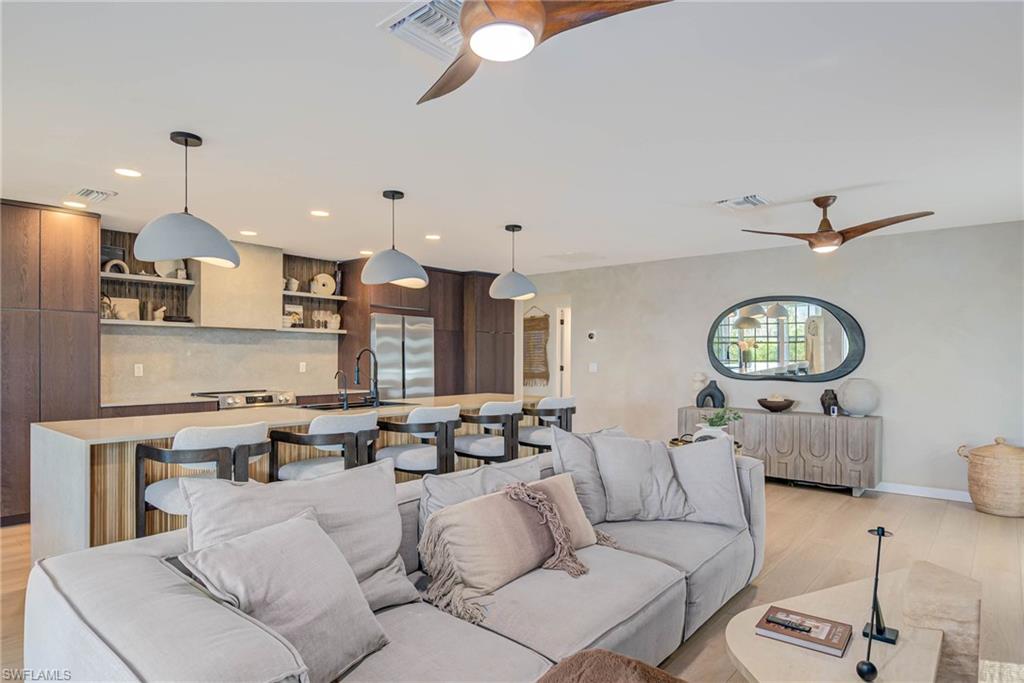 to the Rt of the kitchen are two bedrooms and a shared bathroom