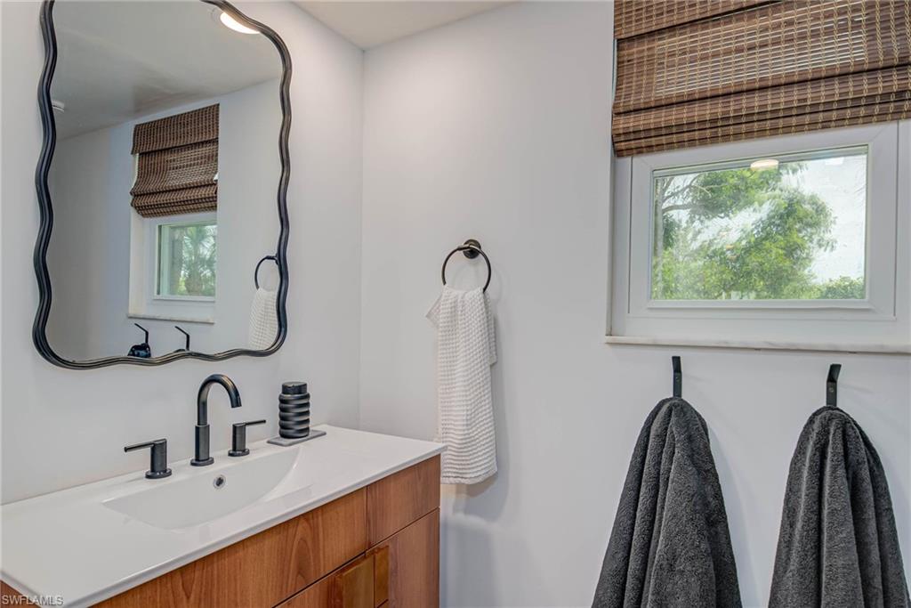 Bathroom with vanity and plenty of natural light