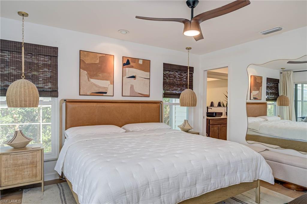 Bedroom featuring NEW windows and NEW luxury vinyl floors and ceiling fan