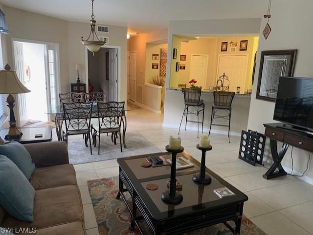 Living room featuring light tile patterned floors