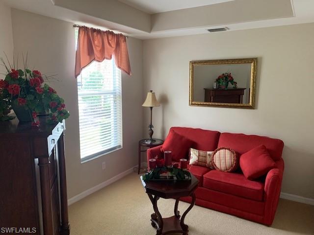 Living room with light tile patterned floors
