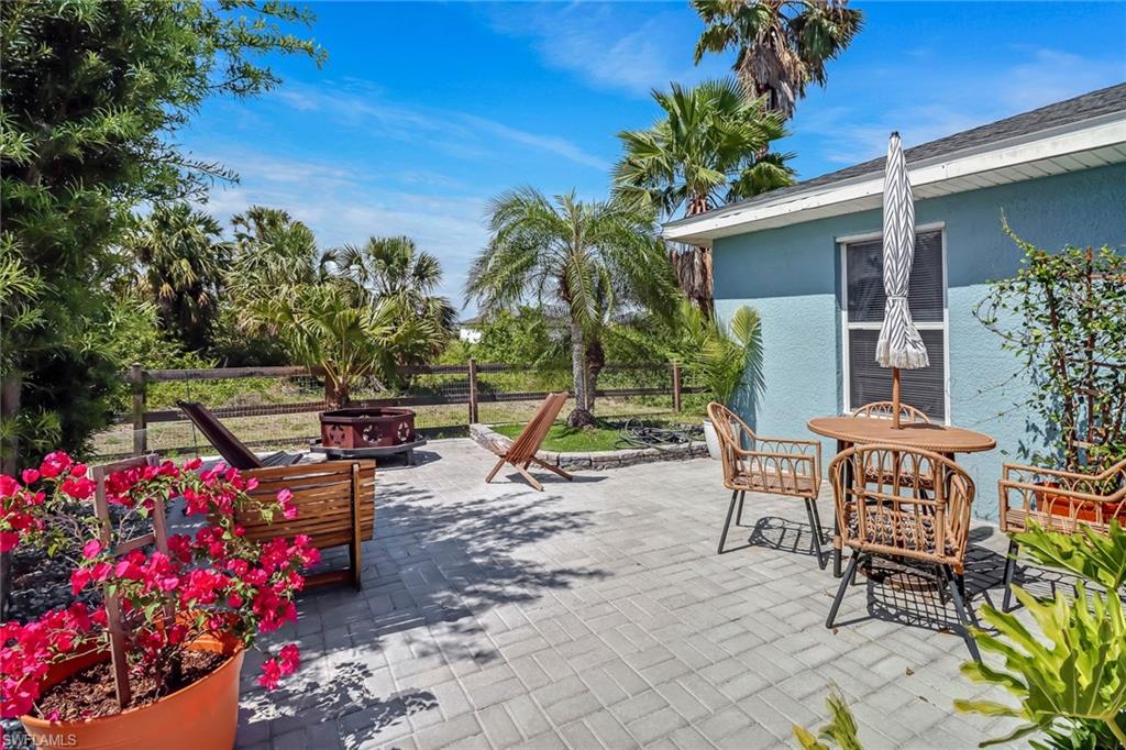 View of patio featuring an outdoor fire pit