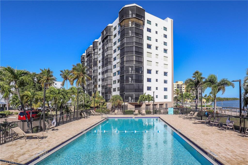 Community pool featuring a patio