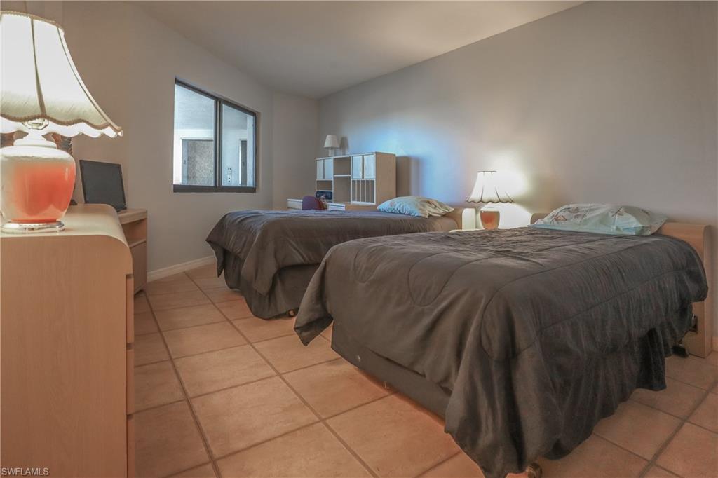 Bedroom featuring light tile patterned flooring