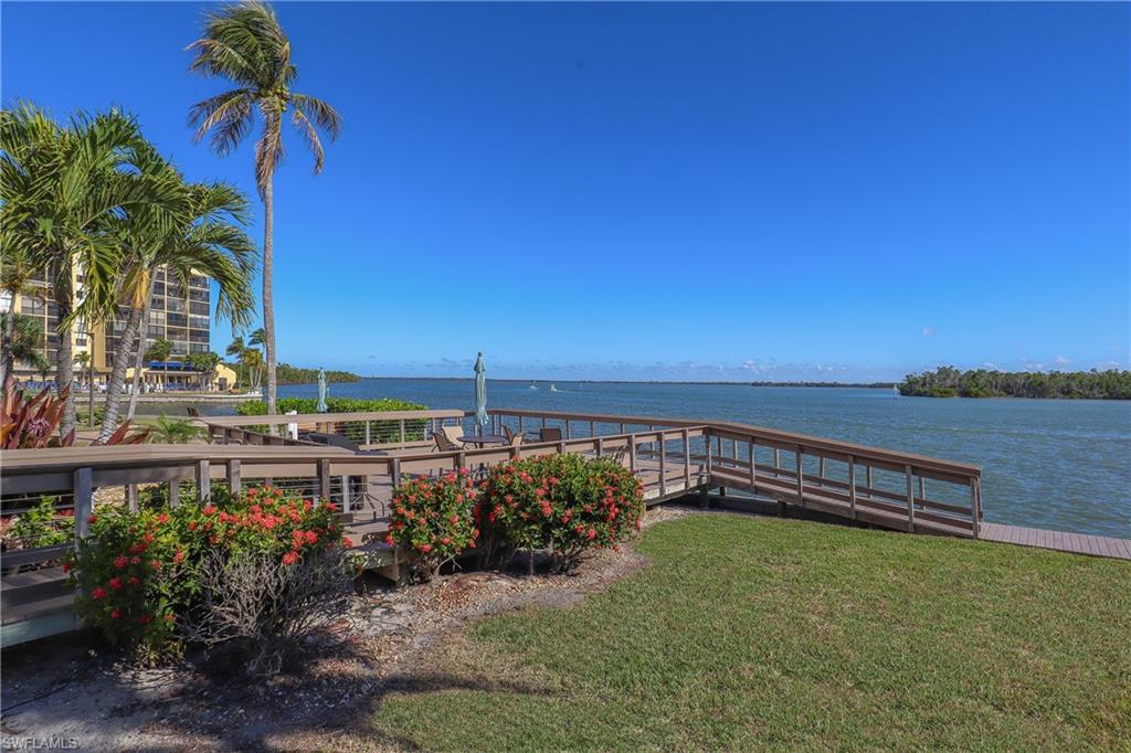 Dock featuring a water view of Estero Bay