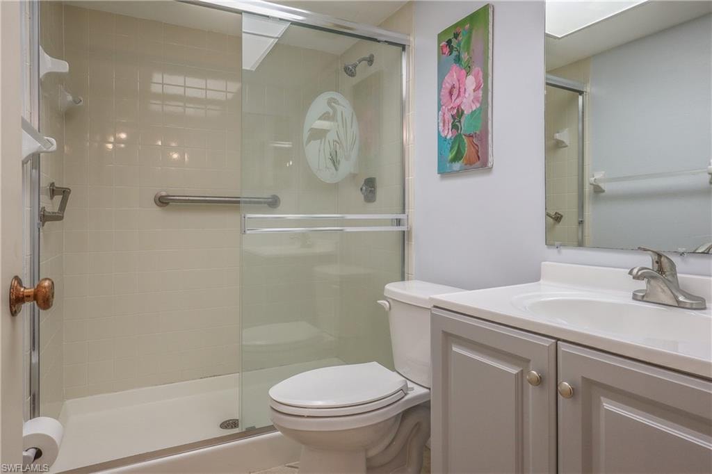 Full bathroom with a stall shower and vanity