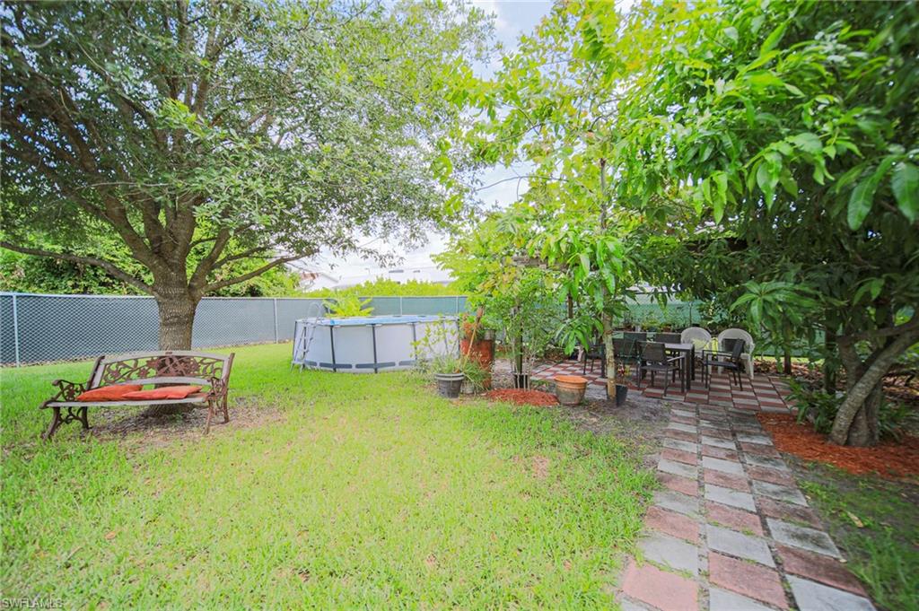 Fenced backyard with a patio