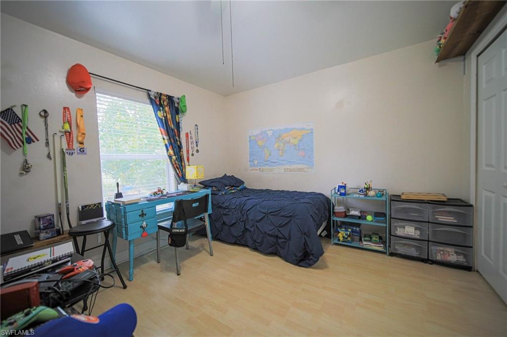 Bedroom with wood finished floors