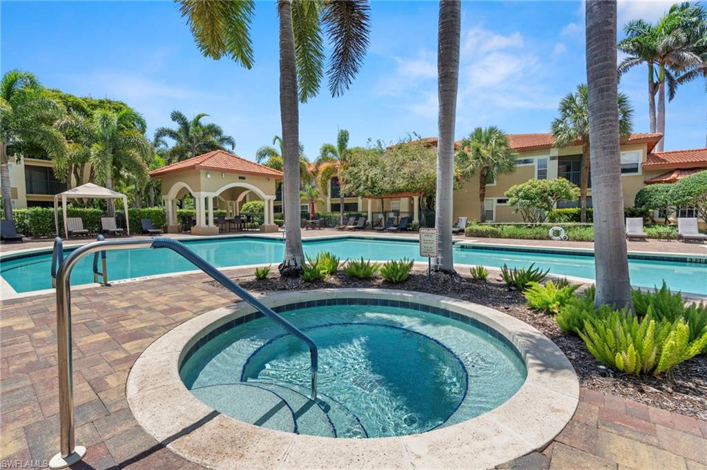 Community pool with a hot tub, a patio area, and a gazebo