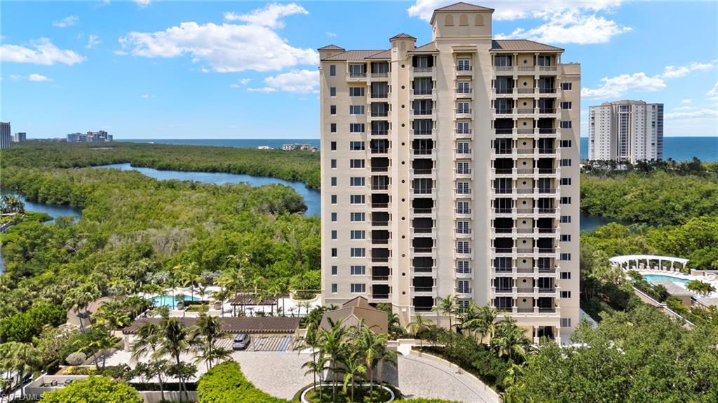 View of apartment building / complex featuring a water view