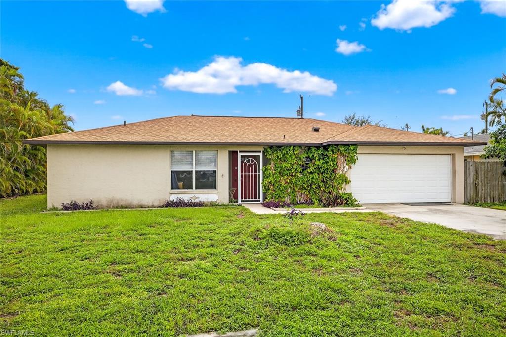 Ranch-style house featuring a garage, concrete driveway, stucco siding, and roof with shingles