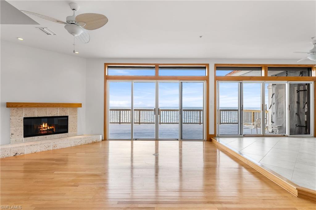 Unfurnished bedroom with light wood finished floors, a closet, and a ceiling fan