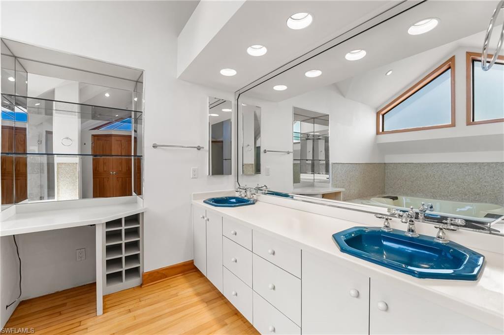 Bathroom featuring a whirlpool tub and wainscoting