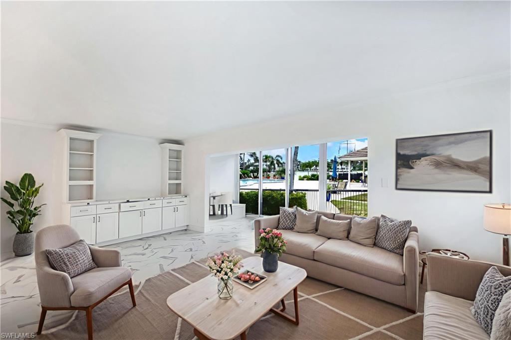 Virtually staged to show furniture options-living room & Florida room