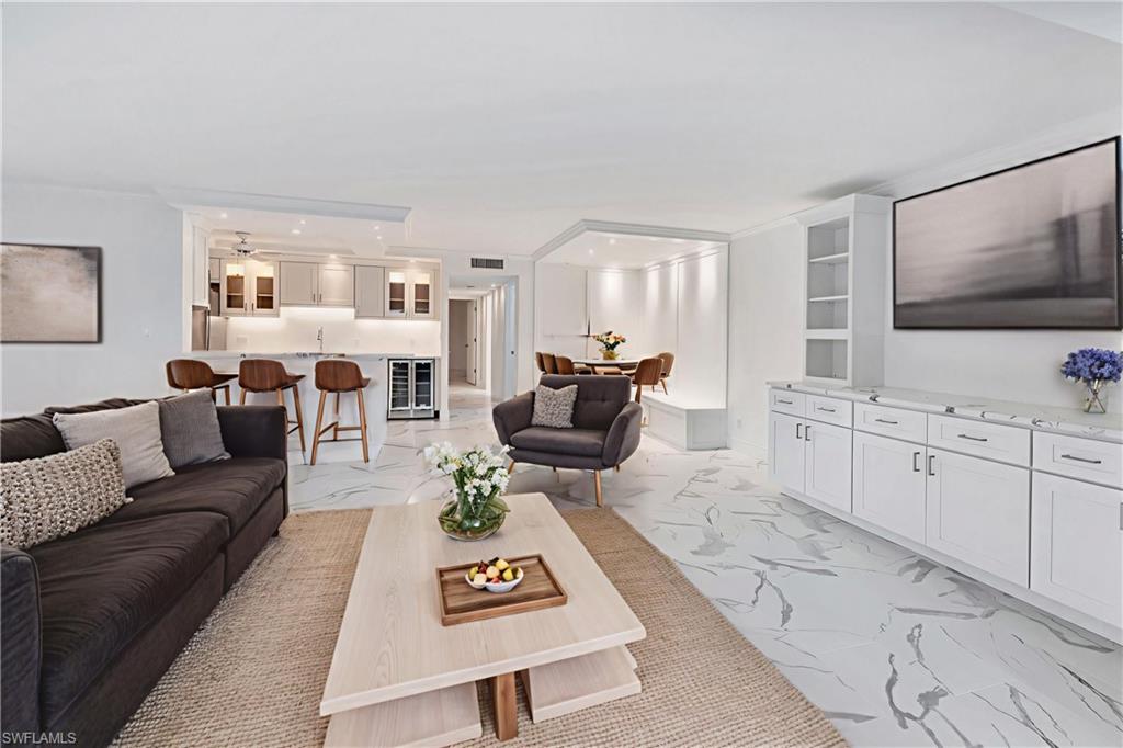 Virtually staged to show furniture options-living room, dining & breakfast bar