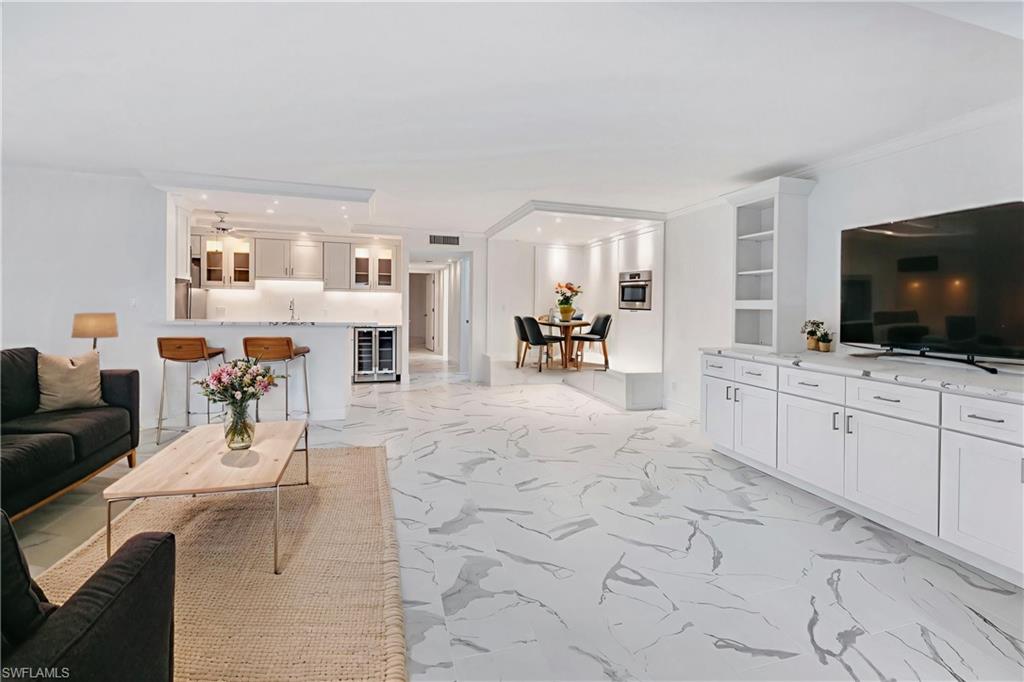 Virtually staged to show furniture options-living room, dining & breakfast bar