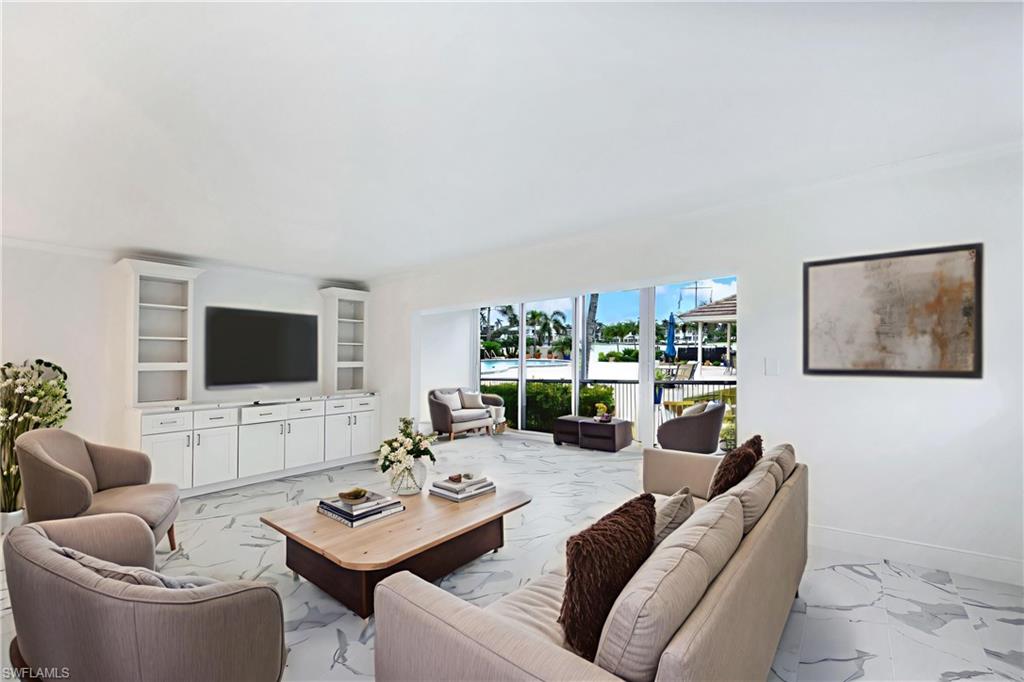 Virtually staged to show furniture options-living room & Florida room