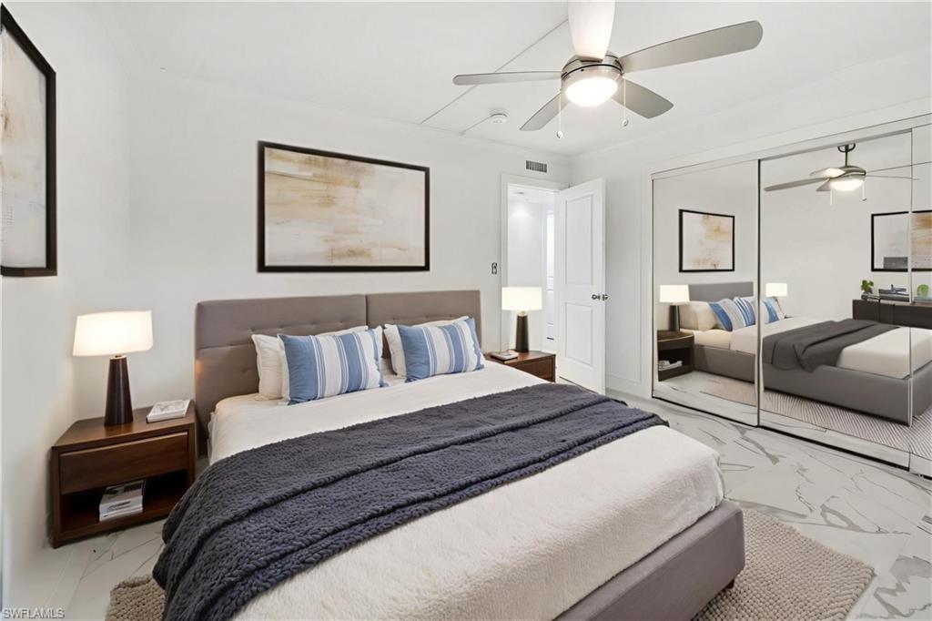 Virtually staged. Entire wall of closets with floor to ceiling mirrored doors