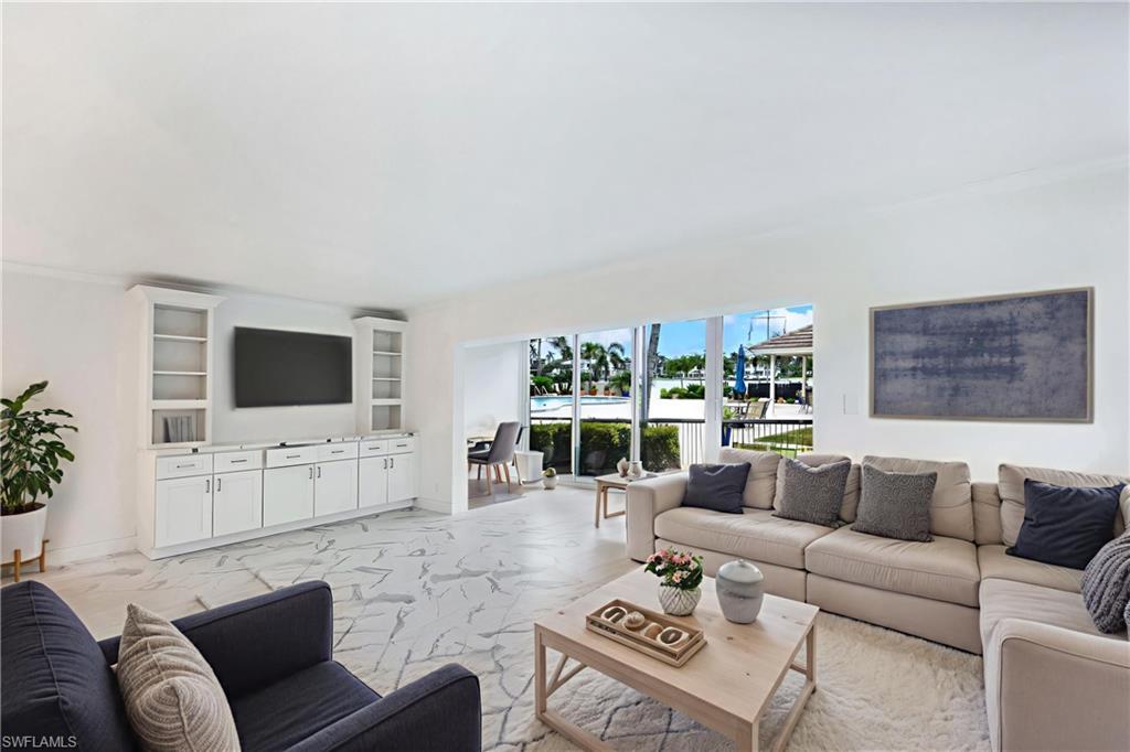 Virtually staged to show furniture options-living room & Florida room