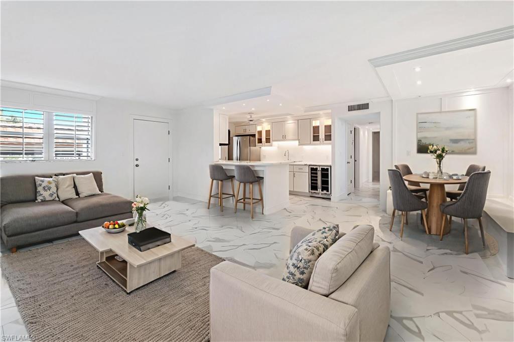 Virtually staged to show furniture options-living room & dining room