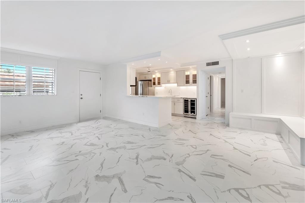 The dining area features built-in seating & specialty lighting