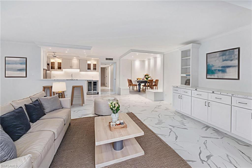 Virtually staged to show furniture options-living room, dining & breakfast bar